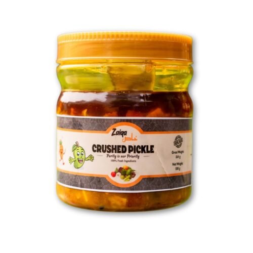 A product shot of a jar of Zaiqa Khas Crushed Pickle, featuring a brown label with the brand name and product description.